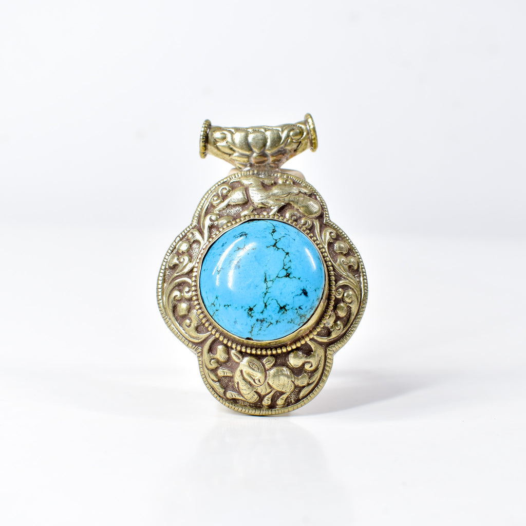 Tibetan Turquoise Colored Repoussé Pendant