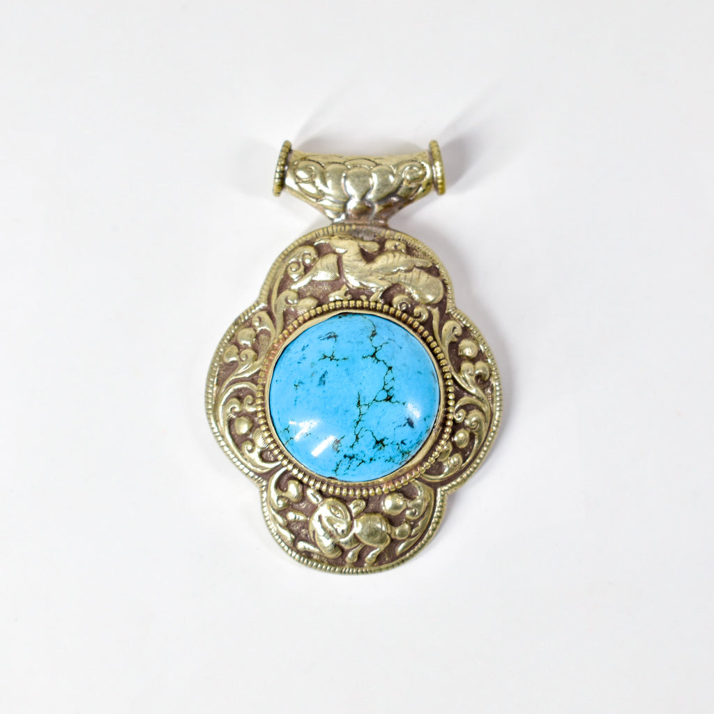 Tibetan Turquoise Colored Repoussé Pendant