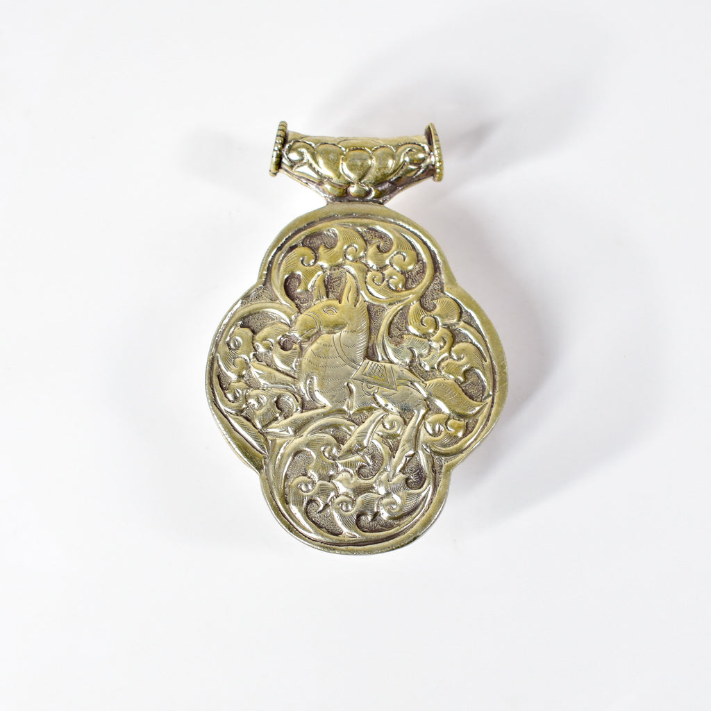 Tibetan Turquoise Colored Repoussé Pendant