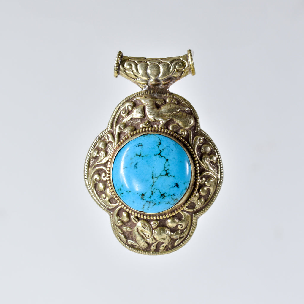 Tibetan Turquoise Colored Repoussé Pendant