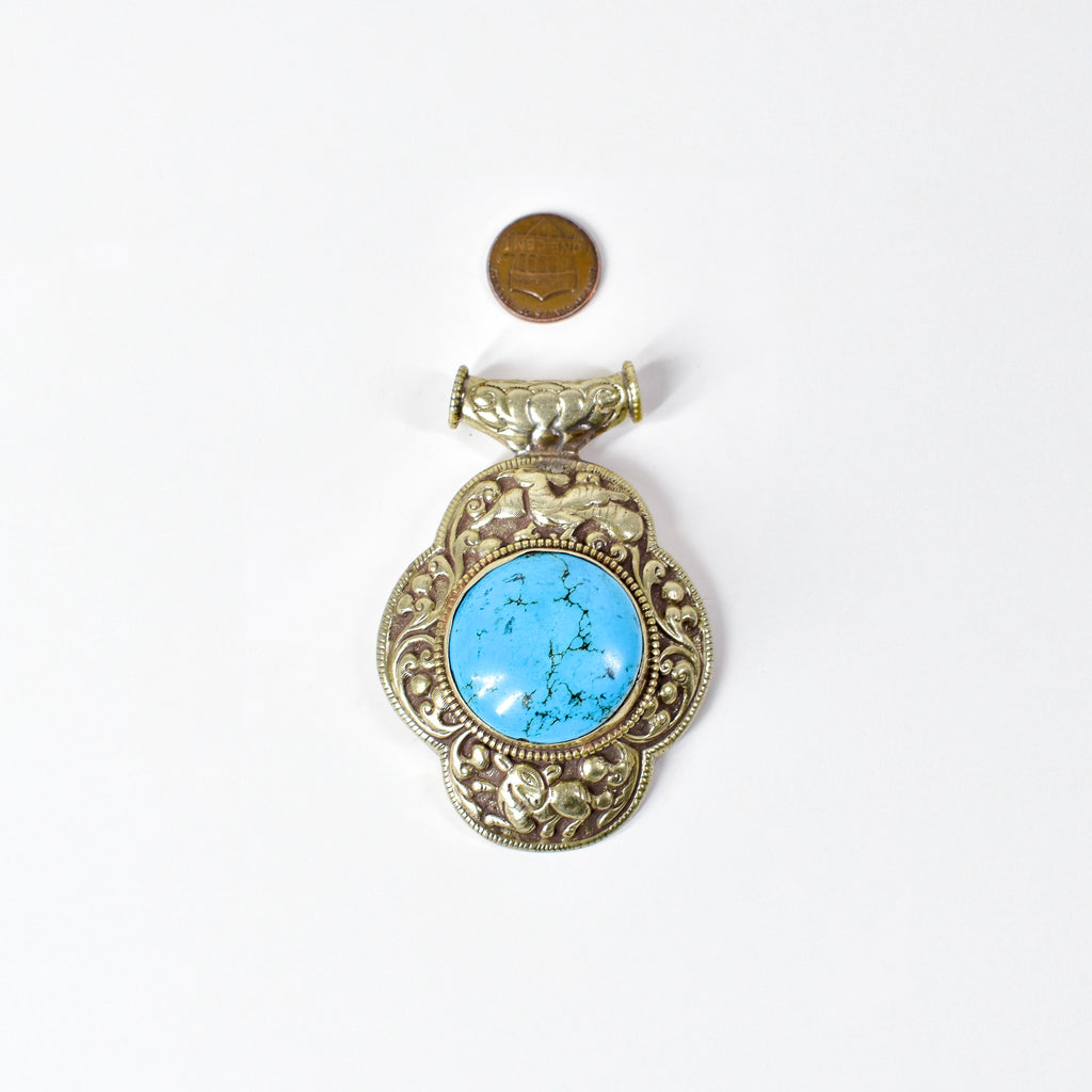 Tibetan Turquoise Colored Repoussé Pendant