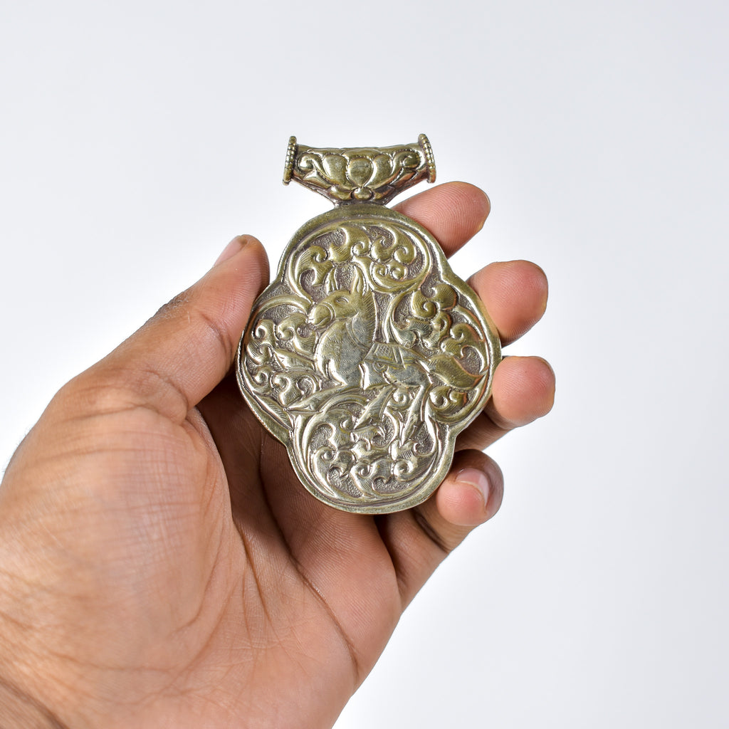 Tibetan Turquoise Colored Repoussé Pendant