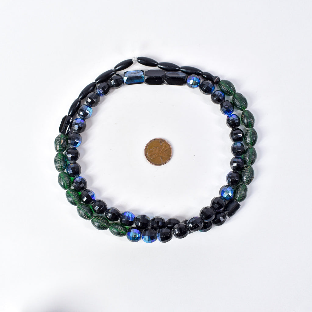 Iridescent Faceted Graduated Bohemian Black Trade Beads