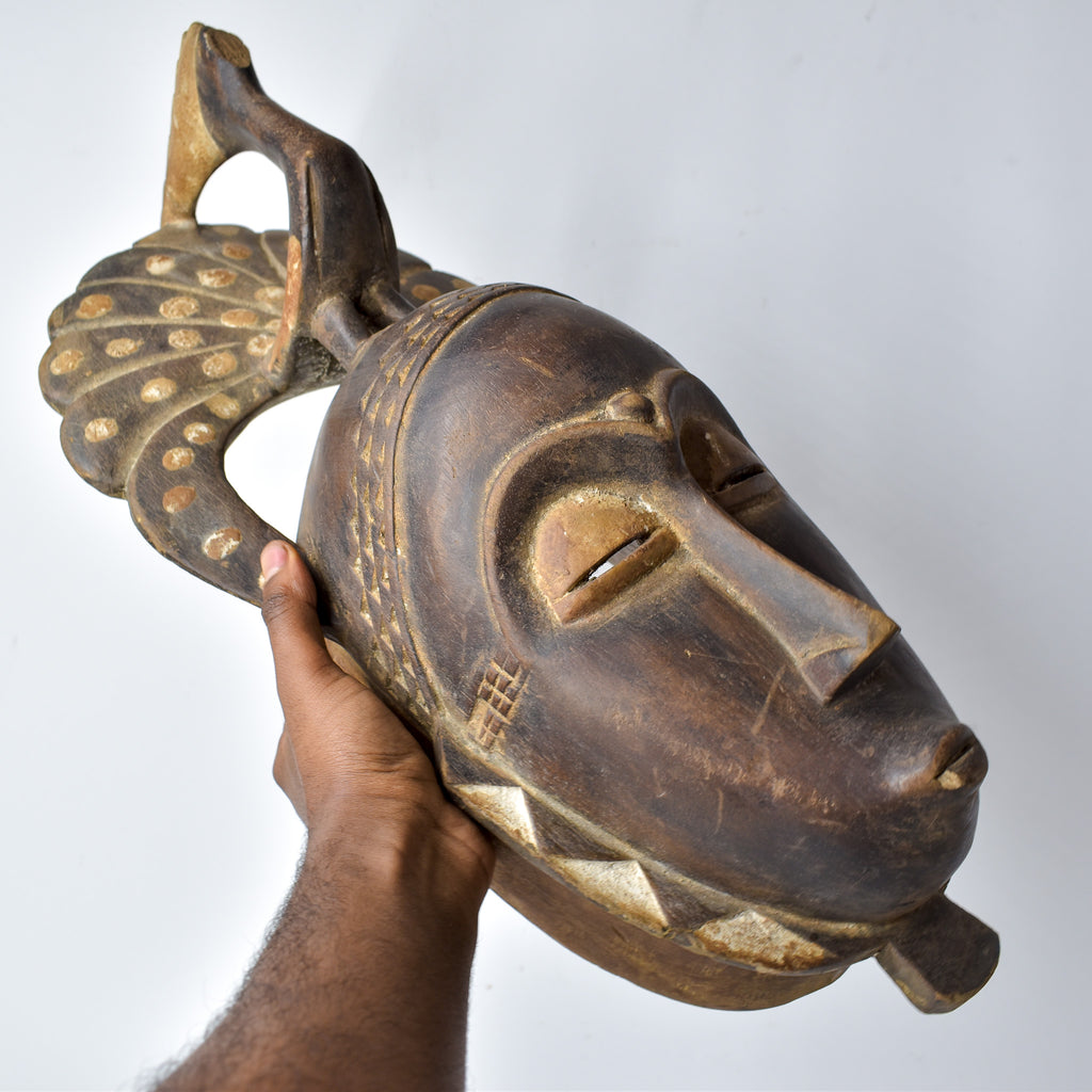 Guro Figural Mask with Peacock Côte d'Ivoire