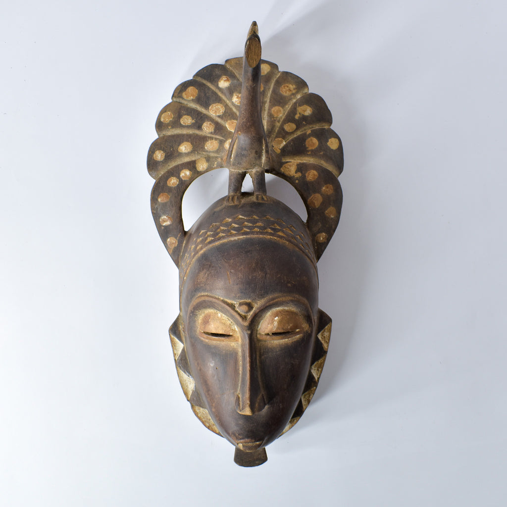 Guro Figural Mask with Peacock Côte d'Ivoire