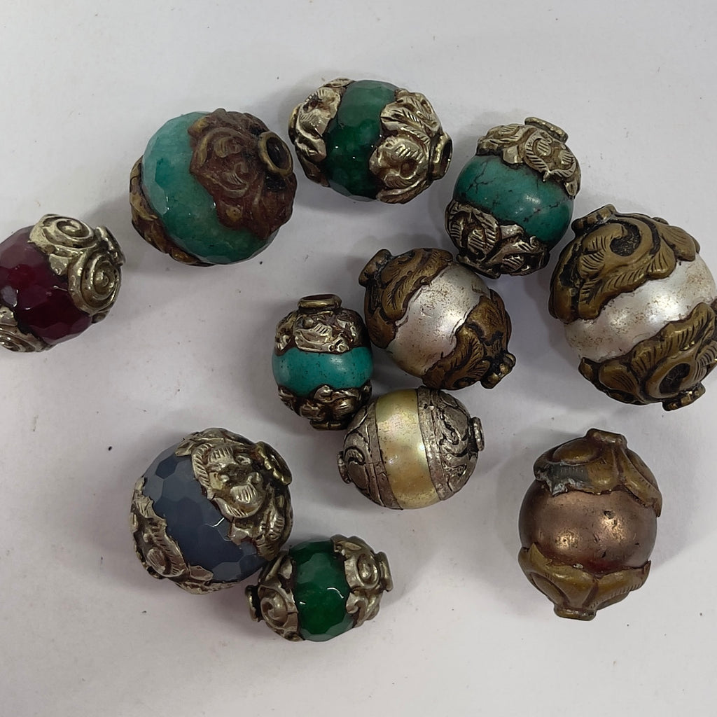 11 Loose Tibetan Repoussé Beads