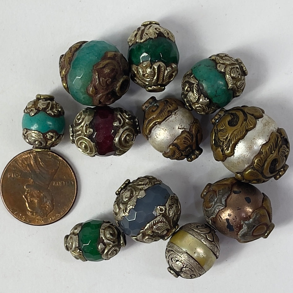11 Loose Tibetan Repoussé Beads