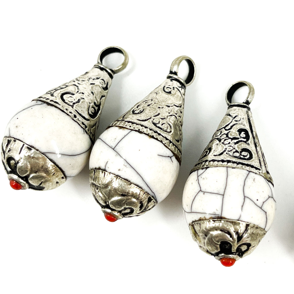 4 Tibetan Pendants White Crackle with Silver Repoussé