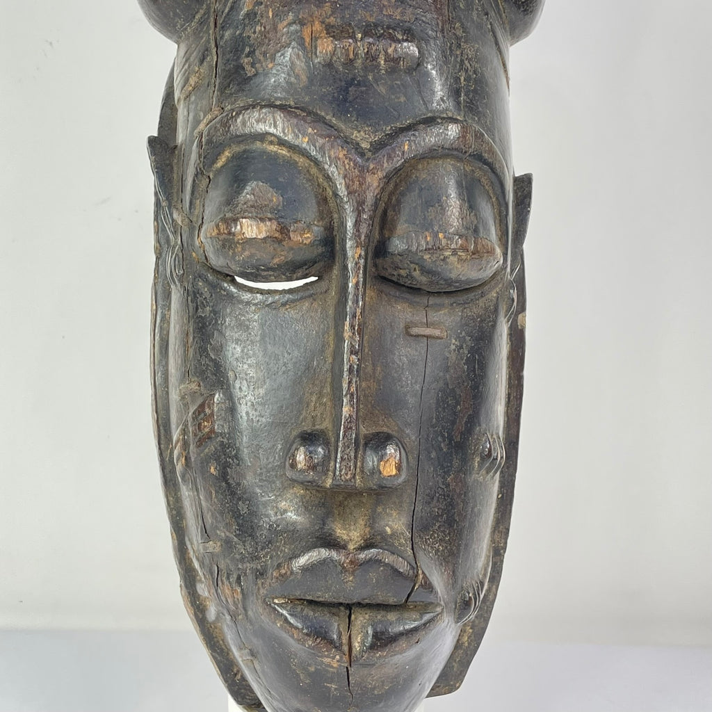 Baule Portrait Mask with Indigenous Repairs Côte d'Ivoire