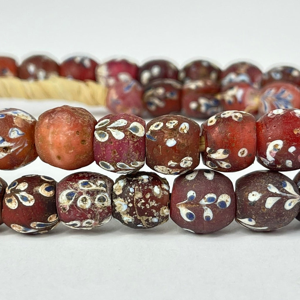 Plum Red Fancy Floral and Skunk Venetian Trade Beads