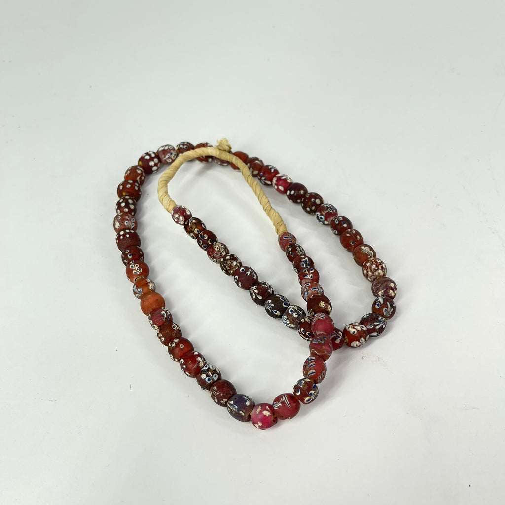 Plum Red Fancy Floral and Skunk Venetian Trade Beads