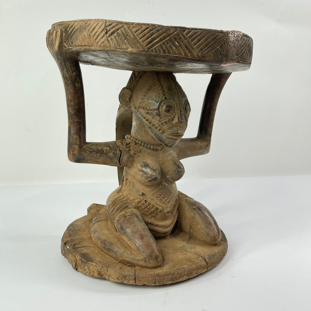 Tabwa Figural Stool with Indigenous Repairs