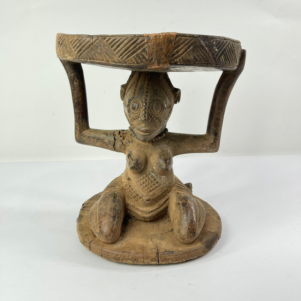 Tabwa Figural Stool with Indigenous Repairs
